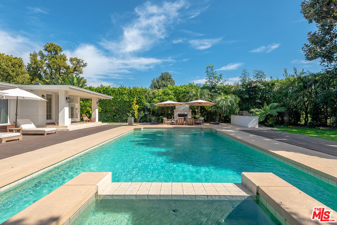 10424 Valley Spring Lane Toluca Lake, CA 91602 - Photo 28 of 44 a view of a house with a yard