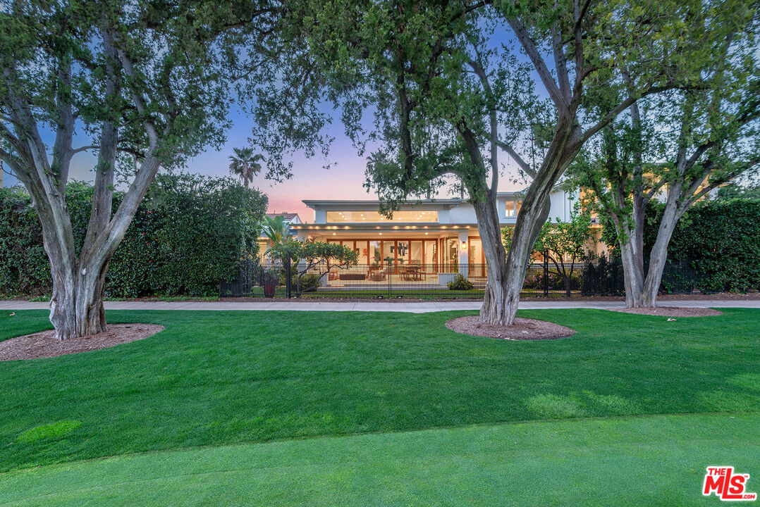 10424 Valley Spring Lane Toluca Lake, CA 91602 - Photo 3 of 44 a view of a house with garden and trees