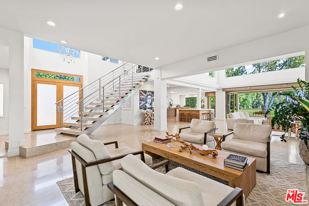 10424 Valley Spring Lane Toluca Lake, CA 91602 - Photo 34 of 44 a living room with furniture and a large window
