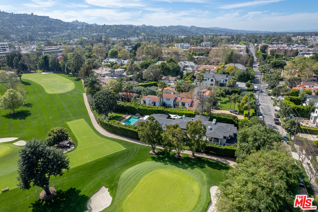 10424 Valley Spring Lane Toluca Lake, CA 91602 - Photo 4 of 44 an aerial view of a golf course with a swimming pool