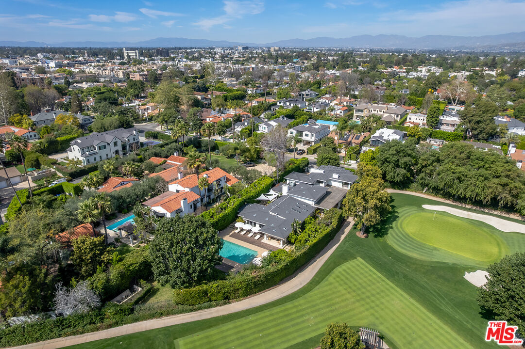 10424 Valley Spring Lane Toluca Lake, CA 91602 - Photo 42 of 44 an aerial view of residential houses with outdoor space and trees