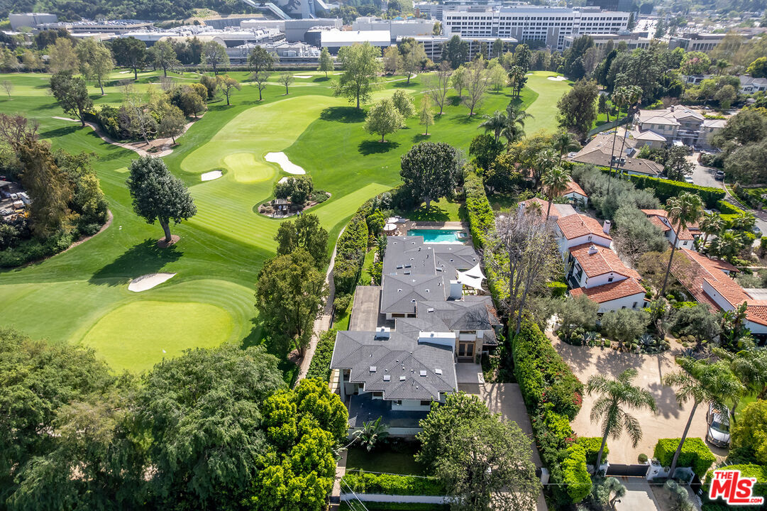 10424 Valley Spring Lane Toluca Lake, CA 91602 - Photo 43 of 44 an aerial view of a house with a garden and swimming pool