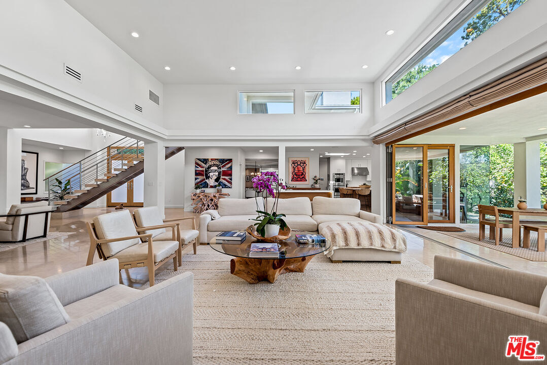 10424 Valley Spring Lane Toluca Lake, CA 91602 - Photo 5 of 44 a living room with furniture and a large window