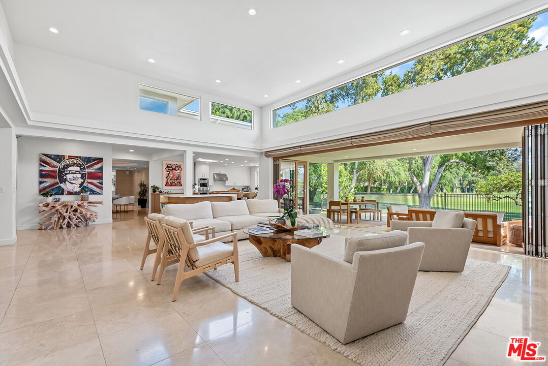 10424 Valley Spring Lane Toluca Lake, CA 91602 - Photo 7 of 44 a living room with furniture and a large window