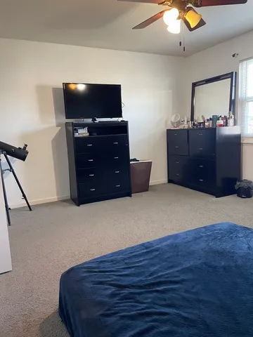 a living room with furniture and flat screen tv