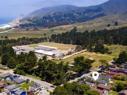 a view of a city with mountains in the background