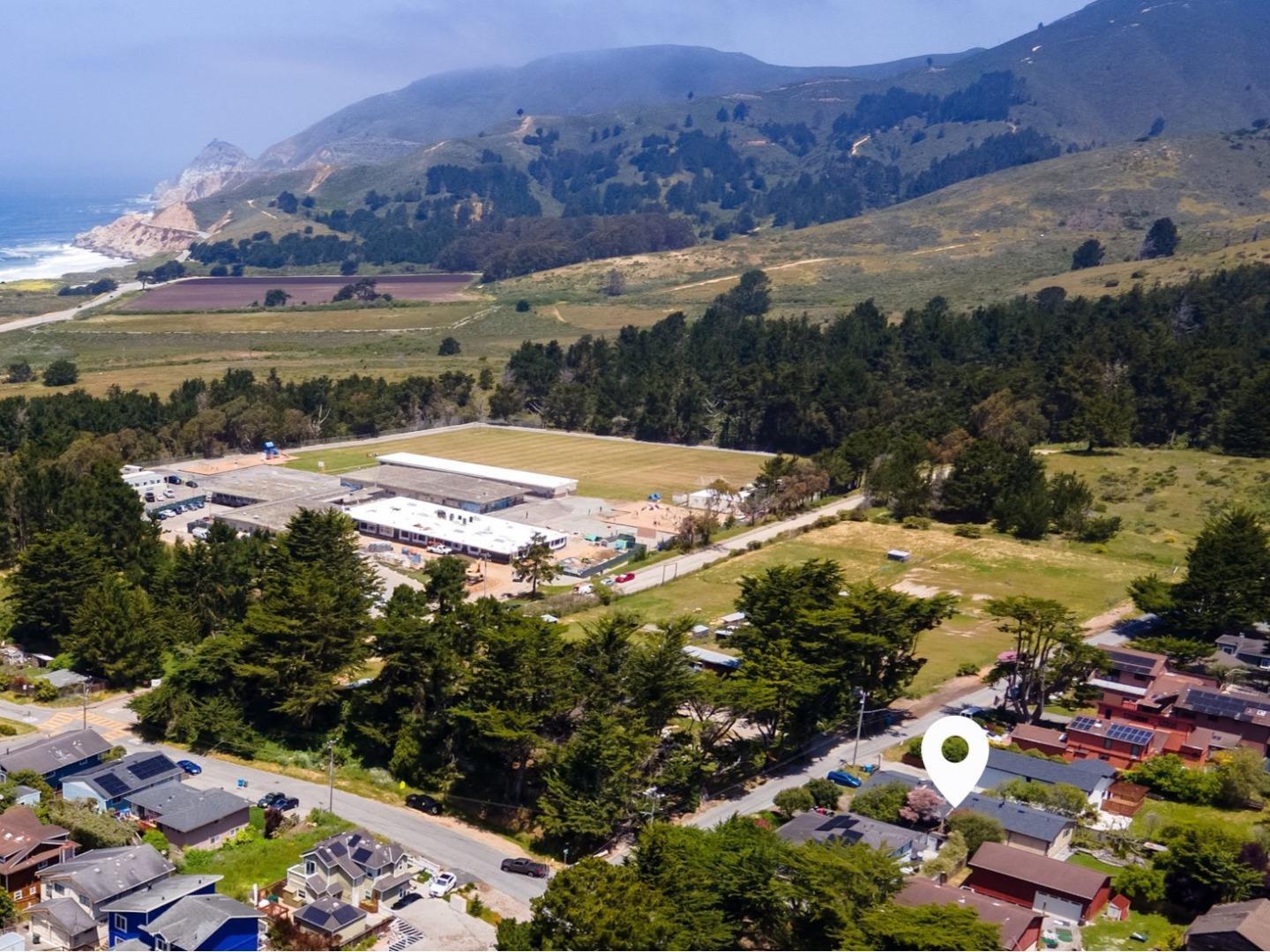 a view of a city with mountains in the background