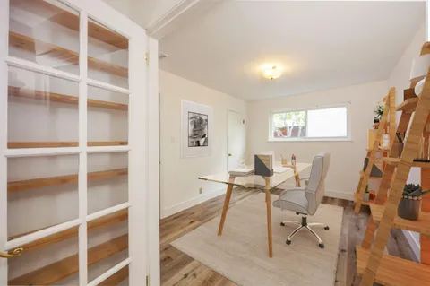 a workspace with furniture and a window