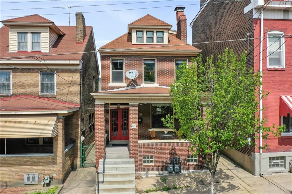 219 Main Street Pittsburgh, PA 15201 - Photo 2 of 35 a front view of a house with a porch
