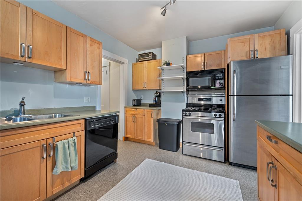 219 Main Street Pittsburgh, PA 15201 - Photo 21 of 35 a kitchen with stainless steel appliances granite countertop a refrigerator sink and stove