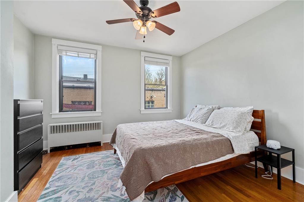 219 Main Street Pittsburgh, PA 15201 - Photo 29 of 35 a bedroom with a bed and a window