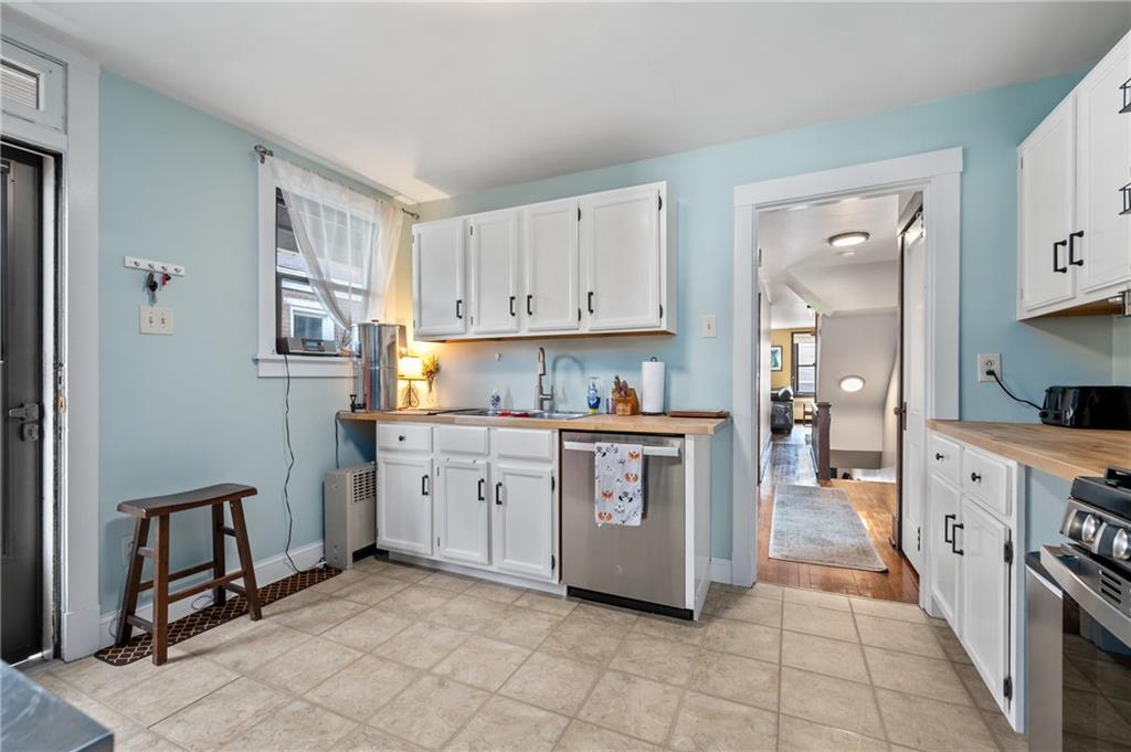219 Main Street Pittsburgh, PA 15201 - Photo 5 of 35 a kitchen with granite countertop a sink and cabinets