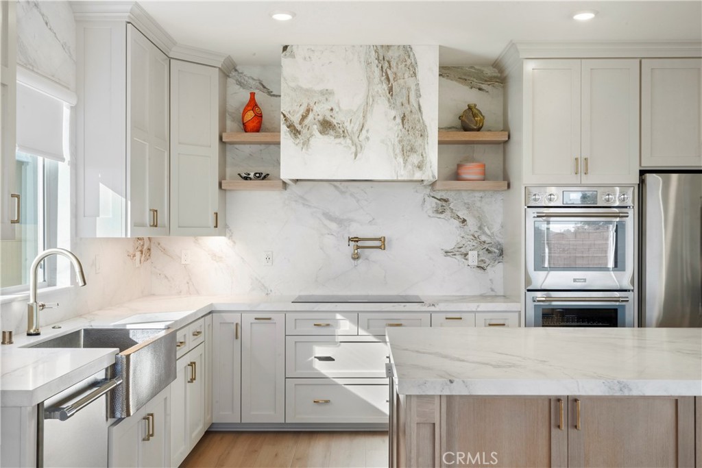 19795 Beavertail Way Riverside, CA 92508 - Photo 1 of 39 Brizo brushed nickel SmartTouch faucet and wall-mounted pot filler