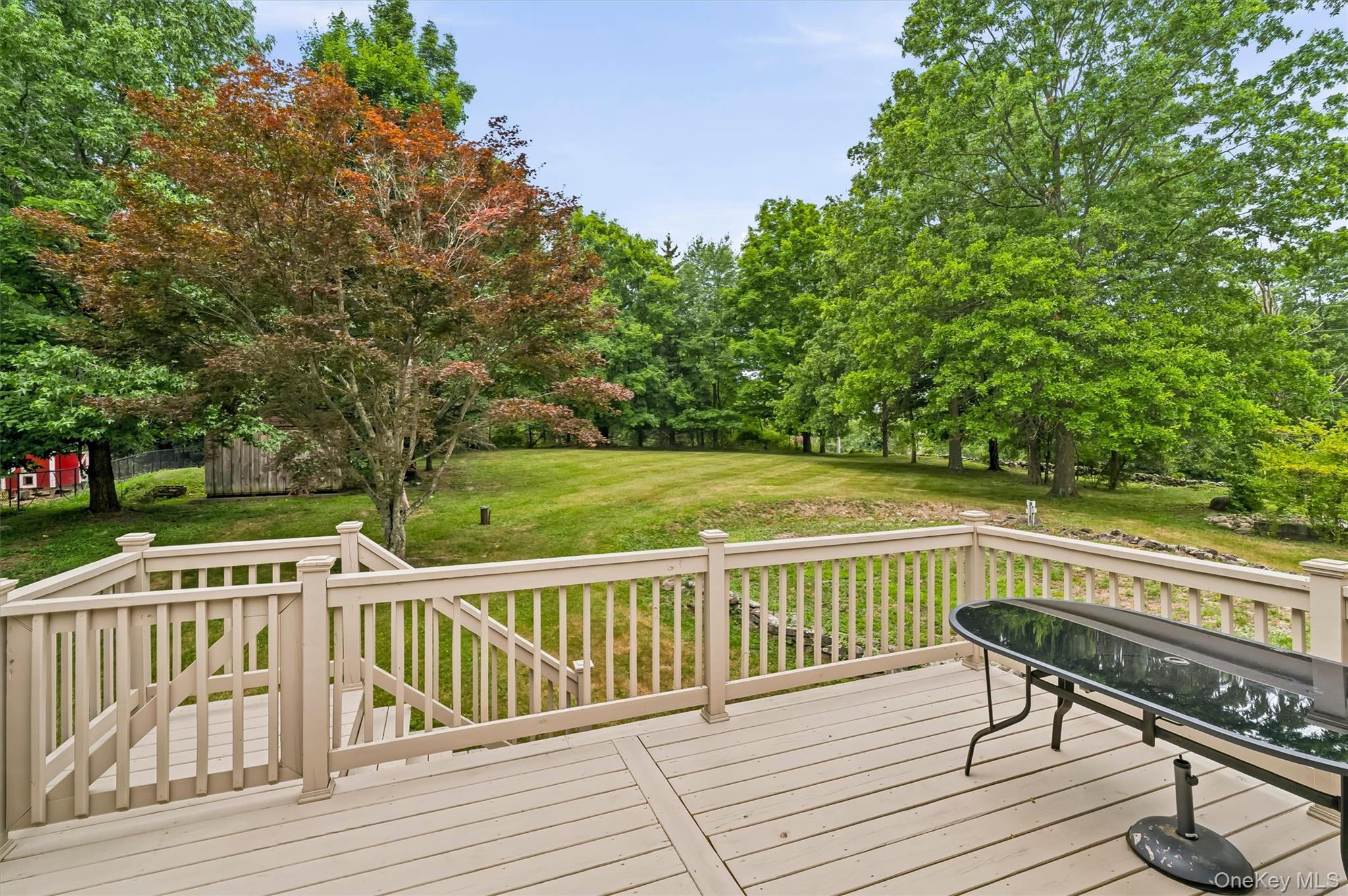318 Beattie Road Washingtonville, NY 10992 - Photo 28 of 42 a view of a wooden deck with a bench