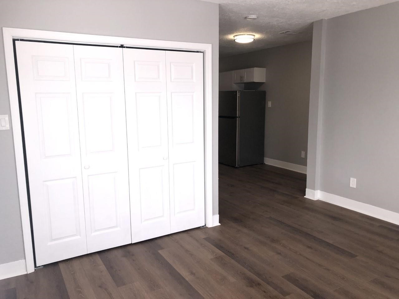 220 Milby Street Houston, TX 77003 - Photo 6 of 11 a view of an empty room with wooden floor and a window