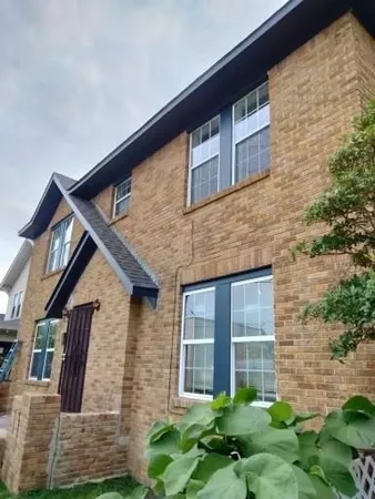 a brick building with a large windows