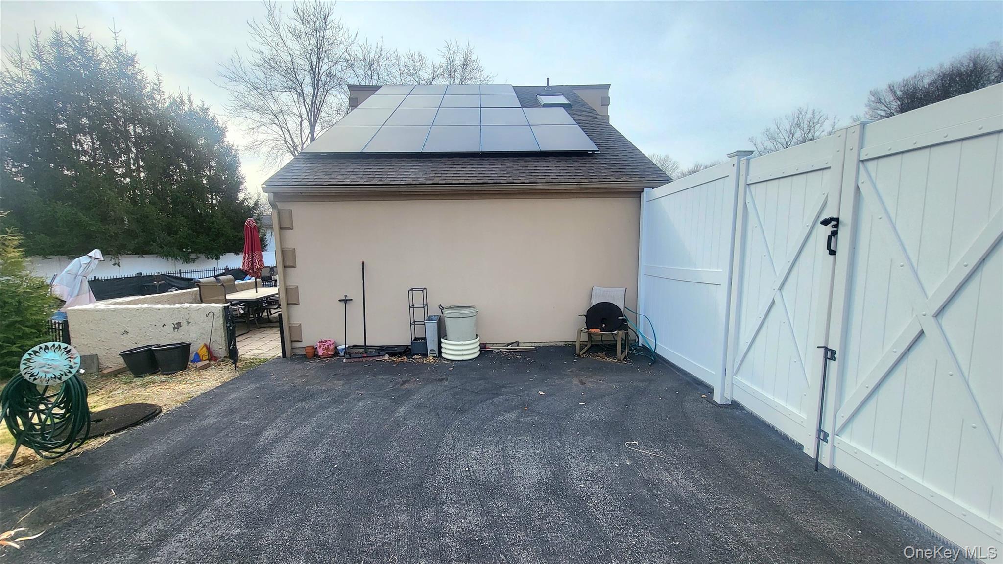 98 Sutton Park Road Poughkeepsie, NY 12603 - Photo 31 of 32 Side of Home With Solar Panels