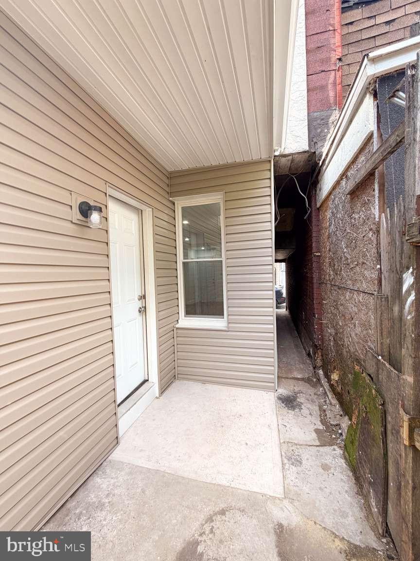 1050 Culvert Street Reading, PA 19602 - Photo 6 of 17 a view of a house with a white door and wooden floor