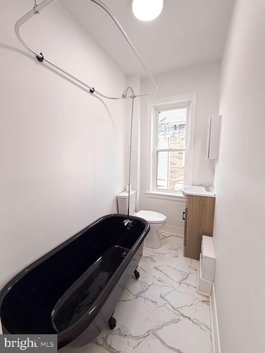 1050 Culvert Street Reading, PA 19602 - Photo 9 of 17 a bath room with a black and white wall