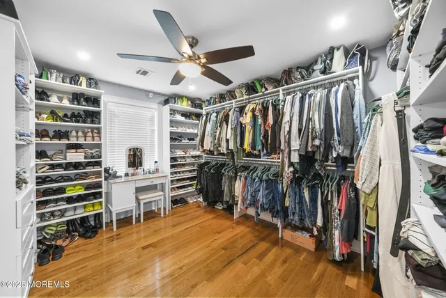 a spacious bathroom with a double vanity sink and a mirror