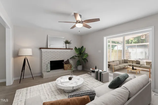 a living room with furniture and a fireplace