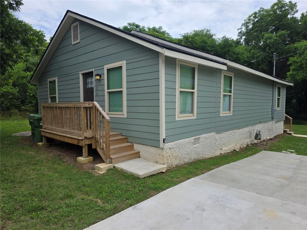 722 Lacy Street Monroe, GA 30655 - Photo 1 of 19 a view of backyard with a garden and entertaining space