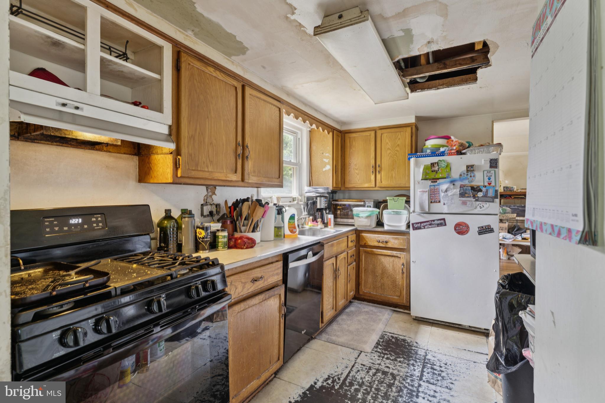 6413 Darwin Road Laurel, MD 20707 - Photo 8 of 17 a kitchen with stainless steel appliances granite countertop a stove and a sink