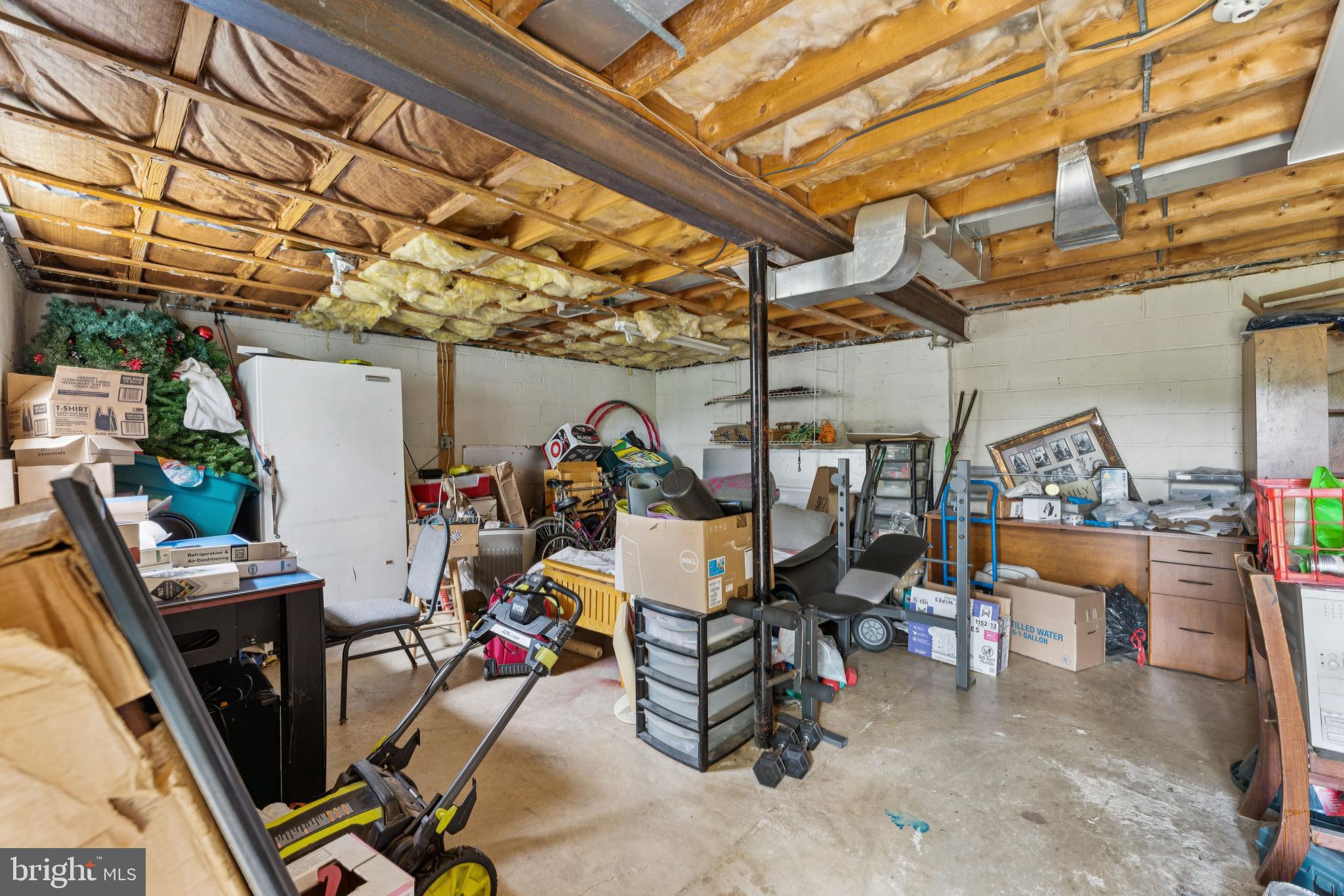 6413 Darwin Road Laurel, MD 20707 - Photo 10 of 17 a view of a storage room with a table and chairs