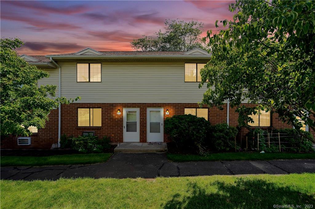 499 Scott Road, Unit 19 Waterbury, CT 06705 - Photo 1 of 1 a front view of house with yard and green space