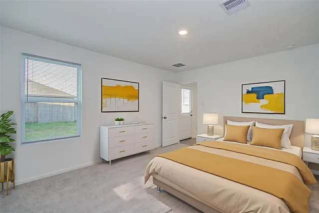 a bedroom with a bed and a window