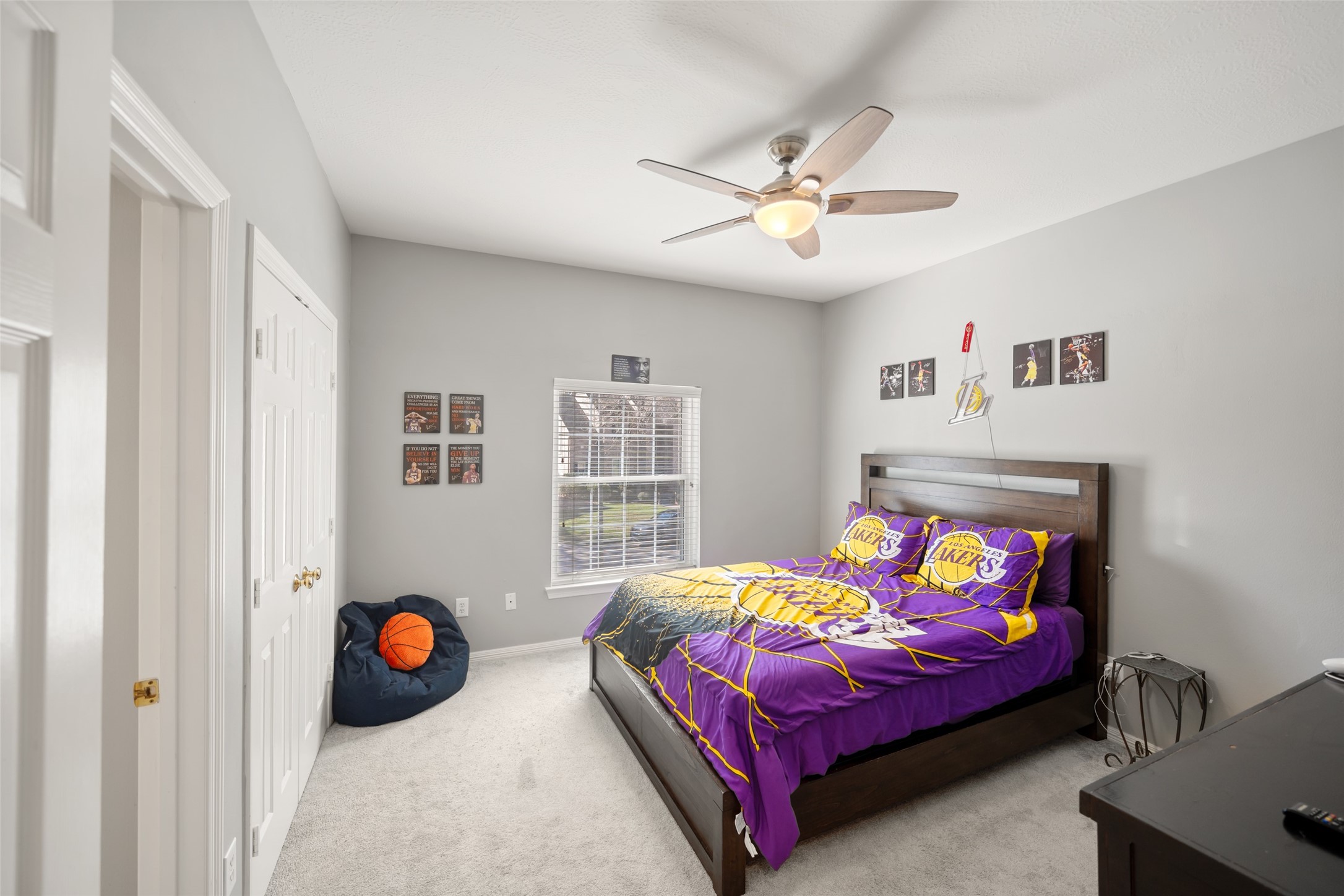 4515 Mulberry Park Lane Kingwood, TX 77345 - Photo 31 of 40 a bedroom with a bed and a chandelier