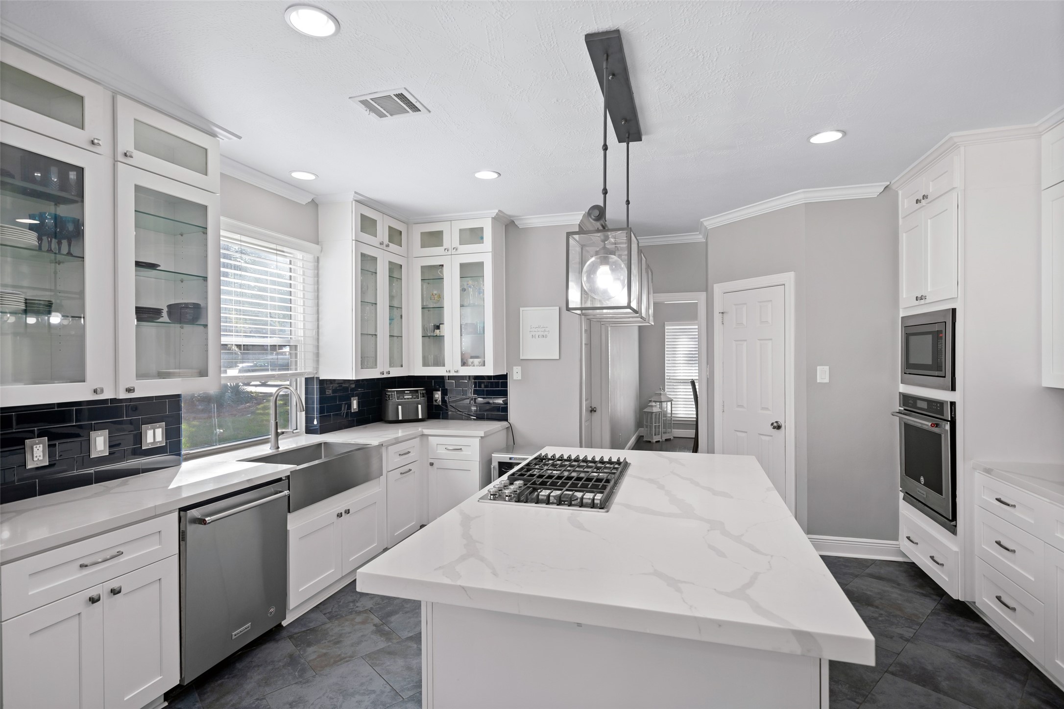 4515 Mulberry Park Lane Kingwood, TX 77345 - Photo 8 of 40 a kitchen with a sink stainless steel appliances and cabinets