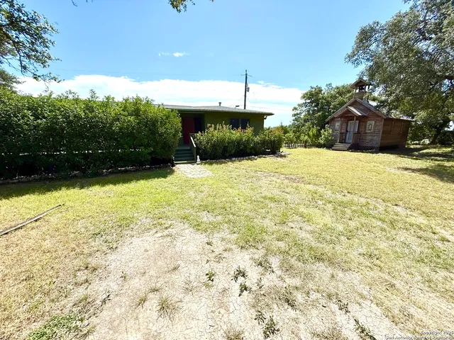 a swimming pool with trees in the background