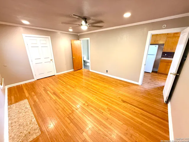 a bedroom with a bed and a mirror