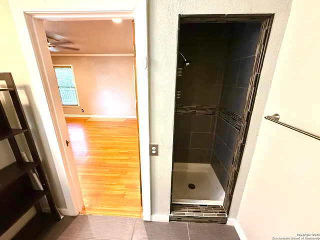 a view of an empty room with a window