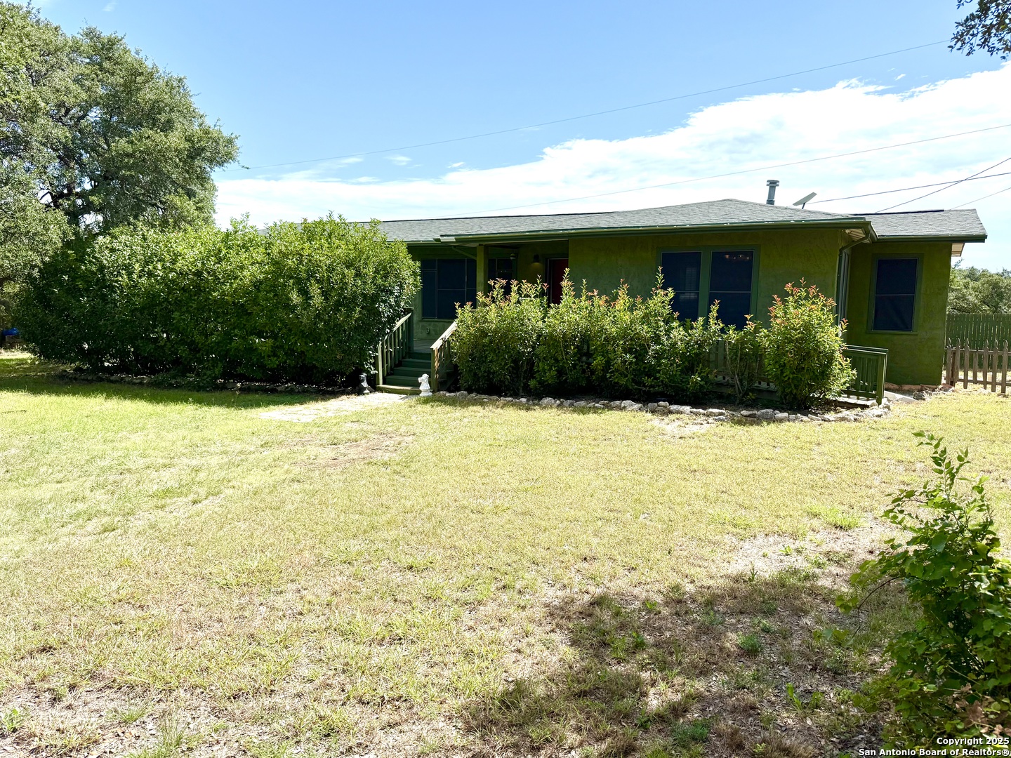 27320 Toutant Beauregard Road Boerne, TX 78006 - Photo 2 of 32 a view of house with swimming pool and outdoor seating