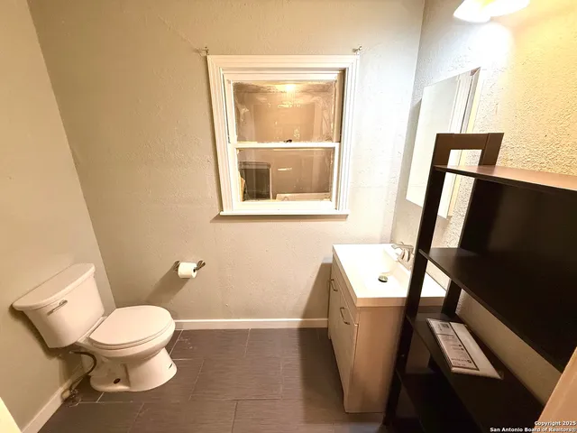 a bathroom with a toilet and a sink