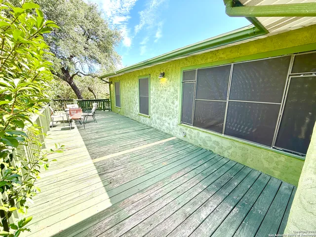 a porch with seating space and hardwood floor