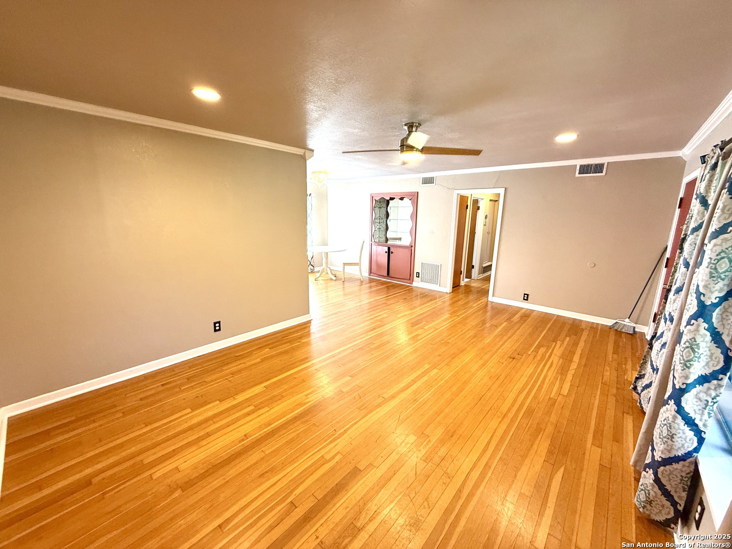 27320 Toutant Beauregard Road Boerne, TX 78006 - Photo 6 of 32 a view of an empty room with window and wooden floor