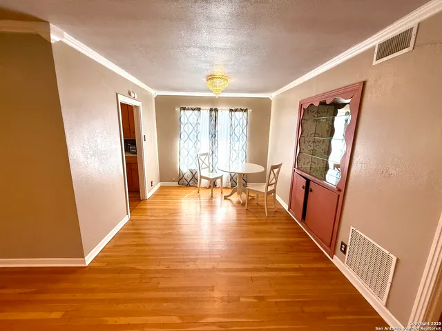 a view of an entryway with wooden floor