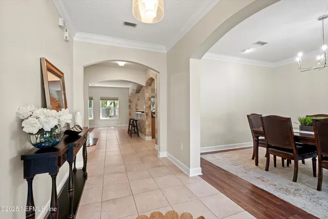 a lobby with furniture and a potted plant