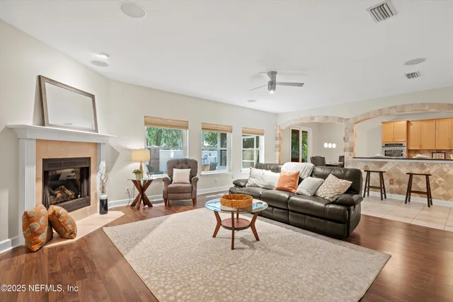 a living room with furniture and a fireplace