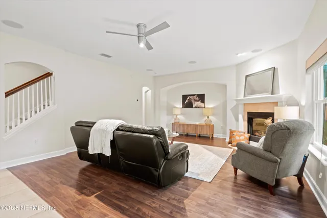 a living room with furniture and a fireplace