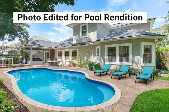 a view of swimming pool with outdoor seating