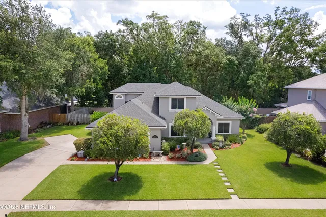 a swimming pool with outdoor seating and yard