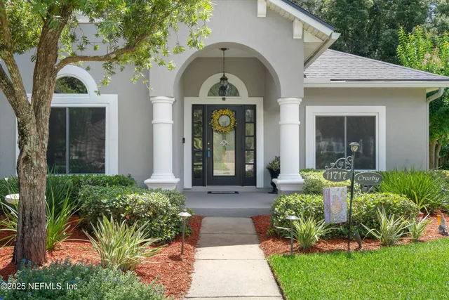 a front view of a house with garden