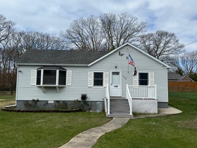 128 Maywood Road Mastic Beach, NY 11951 - Photo 2 of 11 a front view of house with yard and green space