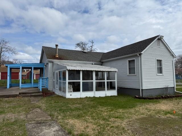 128 Maywood Road Mastic Beach, NY 11951 - Photo 4 of 11 a view of a house with a backyard
