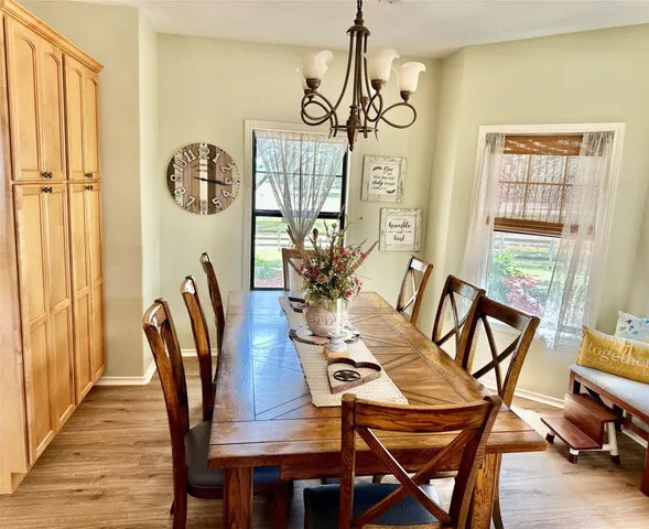 a bathroom with a double vanity sink a mirror and a bathtub