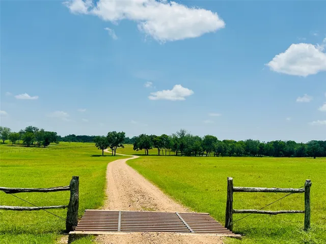 a view of a house with a yard and garage